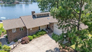This exceptional lakefront home, located in Seven Lakes West on Beacon Ridge Golf and Country Club in North Carolina - for sale on GolfHomes.com, golf home, golf lot