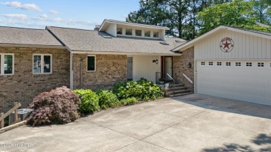 This exceptional lakefront home, located in Seven Lakes West on Beacon Ridge Golf and Country Club in North Carolina - for sale on GolfHomes.com, golf home, golf lot
