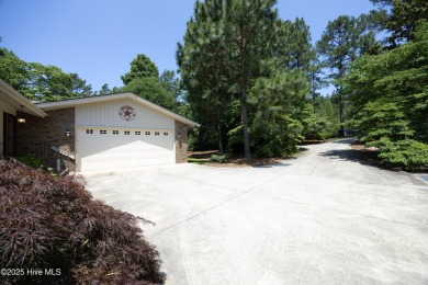 This exceptional lakefront home, located in Seven Lakes West on Beacon Ridge Golf and Country Club in North Carolina - for sale on GolfHomes.com, golf home, golf lot