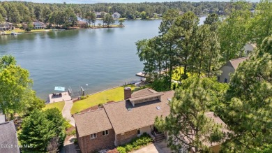 This exceptional lakefront home, located in Seven Lakes West on Beacon Ridge Golf and Country Club in North Carolina - for sale on GolfHomes.com, golf home, golf lot