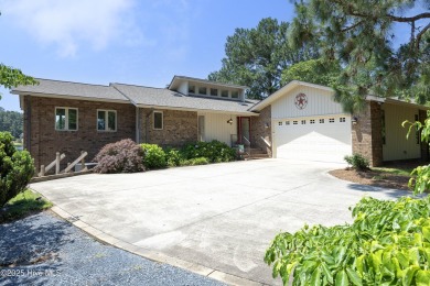 This exceptional lakefront home, located in Seven Lakes West on Beacon Ridge Golf and Country Club in North Carolina - for sale on GolfHomes.com, golf home, golf lot
