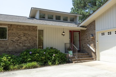 This exceptional lakefront home, located in Seven Lakes West on Beacon Ridge Golf and Country Club in North Carolina - for sale on GolfHomes.com, golf home, golf lot