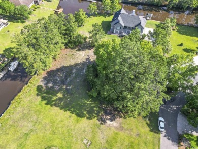 Nestled at the end of a peaceful cul-de-sac in the heart of on Wedgefield Plantation Golf Club in South Carolina - for sale on GolfHomes.com, golf home, golf lot