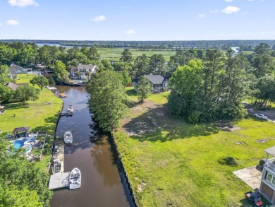 Nestled at the end of a peaceful cul-de-sac in the heart of on Wedgefield Plantation Golf Club in South Carolina - for sale on GolfHomes.com, golf home, golf lot