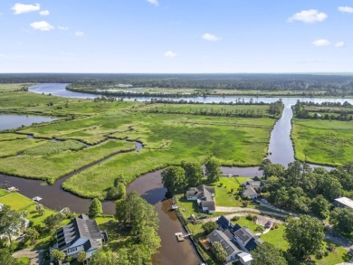Nestled at the end of a peaceful cul-de-sac in the heart of on Wedgefield Plantation Golf Club in South Carolina - for sale on GolfHomes.com, golf home, golf lot