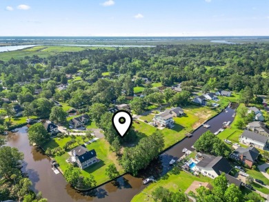 Nestled at the end of a peaceful cul-de-sac in the heart of on Wedgefield Plantation Golf Club in South Carolina - for sale on GolfHomes.com, golf home, golf lot