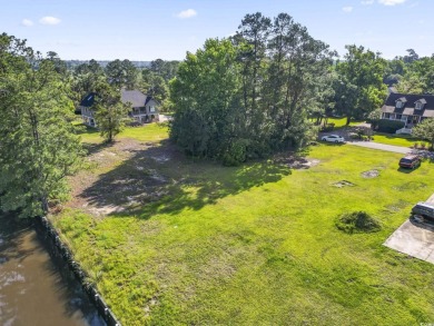 Nestled at the end of a peaceful cul-de-sac in the heart of on Wedgefield Plantation Golf Club in South Carolina - for sale on GolfHomes.com, golf home, golf lot