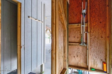 True Beach Beauty in a Superb Location across the street from on Sea Trail Golf Resort in North Carolina - for sale on GolfHomes.com, golf home, golf lot