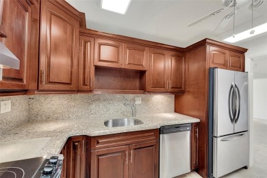 BEAUTIFUL CITY VIEWS FROM THIS UPDATED 2 BEDROOM 2 BATHROOM on Country Club of Coral Springs in Florida - for sale on GolfHomes.com, golf home, golf lot