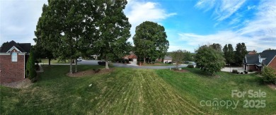 Large, cleared, gently sloping lot in prestigious Rock Barn on Rock Barn Golf and Spa in North Carolina - for sale on GolfHomes.com, golf home, golf lot