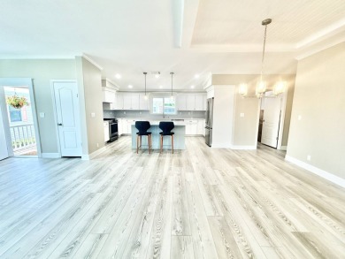 Welcome to Luxury living in the heart of the prestigious 55+ on Crane Lakes Golf and Country Club in Florida - for sale on GolfHomes.com, golf home, golf lot
