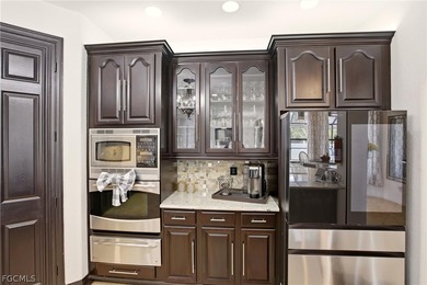 Look at this Custom-Built Stunning Luxury Two-Story Pool Home on Del Tura Golf and Country Club in Florida - for sale on GolfHomes.com, golf home, golf lot