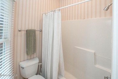 Welcome to 523 Candlewick Lane, a custombuilt ranch home on Ocean Ridge Plantation in North Carolina - for sale on GolfHomes.com, golf home, golf lot