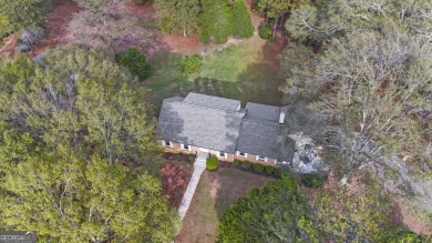 Priced below appraised value! Charming 4-sided brick home on Canongate Golf Club in Georgia - for sale on GolfHomes.com, golf home, golf lot