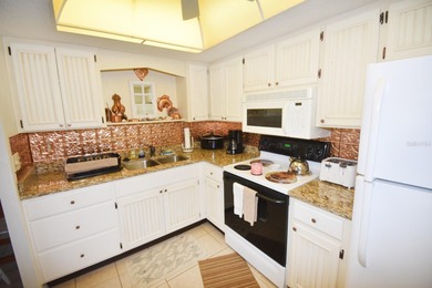 Rarely available ground floor end unit. Easy access to Sharkey's on Lake Venice Golf Club in Florida - for sale on GolfHomes.com, golf home, golf lot