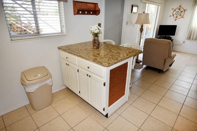 Rarely available ground floor end unit. Easy access to Sharkey's on Lake Venice Golf Club in Florida - for sale on GolfHomes.com, golf home, golf lot