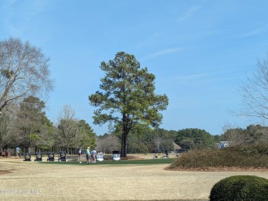 A must-see, beautiful 0.30-acre wooded homesite located in the on River Landing Golf Course in North Carolina - for sale on GolfHomes.com, golf home, golf lot