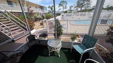 Rarely available ground floor end unit. Easy access to Sharkey's on Lake Venice Golf Club in Florida - for sale on GolfHomes.com, golf home, golf lot