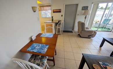 Rarely available ground floor end unit. Easy access to Sharkey's on Lake Venice Golf Club in Florida - for sale on GolfHomes.com, golf home, golf lot