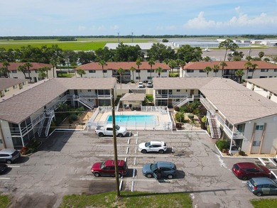 Rarely available ground floor end unit. Easy access to Sharkey's on Lake Venice Golf Club in Florida - for sale on GolfHomes.com, golf home, golf lot