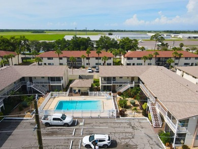 Rarely available ground floor end unit. Easy access to Sharkey's on Lake Venice Golf Club in Florida - for sale on GolfHomes.com, golf home, golf lot