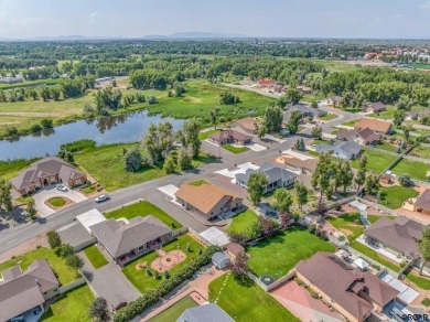 Nestled in the picturesque Cattails Golf Course community in on Cattails Golf Club in Colorado - for sale on GolfHomes.com, golf home, golf lot