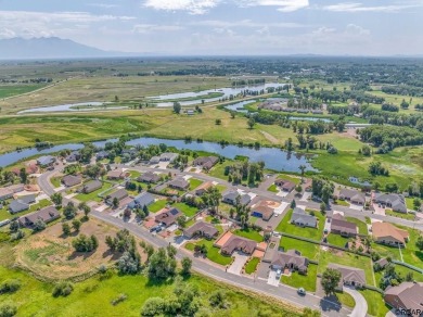 Nestled in the picturesque Cattails Golf Course community in on Cattails Golf Club in Colorado - for sale on GolfHomes.com, golf home, golf lot