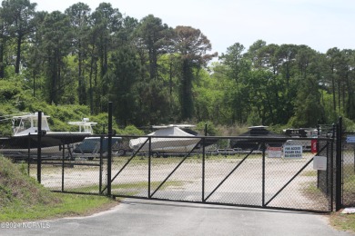 Lovely half acre lot in Seascape backing up to natural area on Lockwood Folly Country Club in North Carolina - for sale on GolfHomes.com, golf home, golf lot