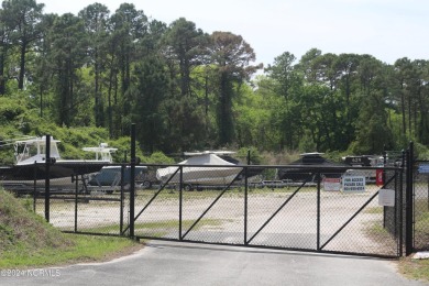 Lovely half acre lot in Seascape backing up to natural area on Lockwood Folly Country Club in North Carolina - for sale on GolfHomes.com, golf home, golf lot
