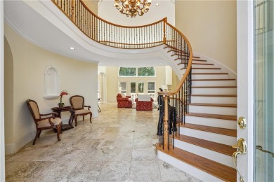 Experience three fully finished levels of exceptional living on The Golf Club of Georgia in Georgia - for sale on GolfHomes.com, golf home, golf lot
