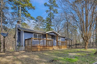 Nestled within minutes of the tranquil waters of Lake Sam on Rayburn Country Club in Texas - for sale on GolfHomes.com, golf home, golf lot