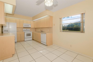 WELL PRICED 1st FLOOR CORNER UNIT in Century Village with 1,507 on Flamingo Lakes Country Club in Florida - for sale on GolfHomes.com, golf home, golf lot