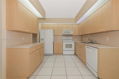 WELL PRICED 1st FLOOR CORNER UNIT in Century Village with 1,507 on Flamingo Lakes Country Club in Florida - for sale on GolfHomes.com, golf home, golf lot