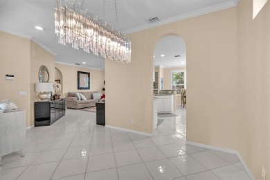 WAKE UP TO SERENE GARDEN VIEWS & INDULGE IN RESORT STYLE on TPC Eagle Trace in Florida - for sale on GolfHomes.com, golf home, golf lot