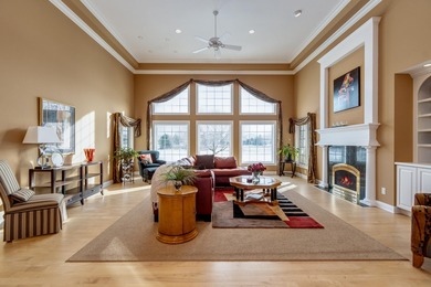 Situated along Hawk's Landing's premier fairway, this custom on Hawks Landing Golf Club in Wisconsin - for sale on GolfHomes.com, golf home, golf lot