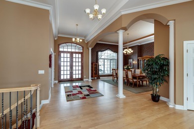 Situated along Hawk's Landing's premier fairway, this custom on Hawks Landing Golf Club in Wisconsin - for sale on GolfHomes.com, golf home, golf lot