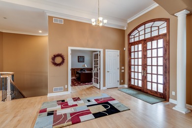 Situated along Hawk's Landing's premier fairway, this custom on Hawks Landing Golf Club in Wisconsin - for sale on GolfHomes.com, golf home, golf lot