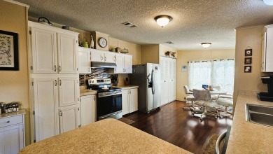 Nestled within the highly sought-after golf course community of on Blue Heron Pines Golf Course in Florida - for sale on GolfHomes.com, golf home, golf lot