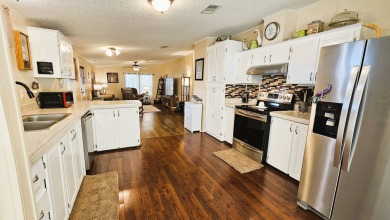 Nestled within the highly sought-after golf course community of on Blue Heron Pines Golf Course in Florida - for sale on GolfHomes.com, golf home, golf lot