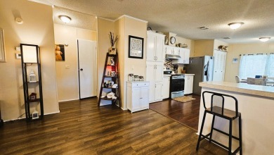 Nestled within the highly sought-after golf course community of on Blue Heron Pines Golf Course in Florida - for sale on GolfHomes.com, golf home, golf lot