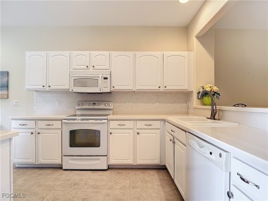 IMMACULATELY maintained, MAINTENANCE FREE attached villa in on Herons Glen Golf and Country Club in Florida - for sale on GolfHomes.com, golf home, golf lot