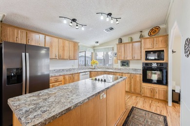 Beautifully maintained and mostly furnished, this spacious 1,456 on Painted Mountain Golf Club in Arizona - for sale on GolfHomes.com, golf home, golf lot