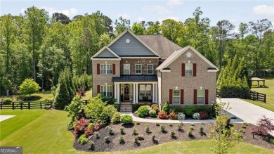 Nestled within one of MiltonCOs most exclusive gated communities on Manor Golf and Country Club in Georgia - for sale on GolfHomes.com, golf home, golf lot