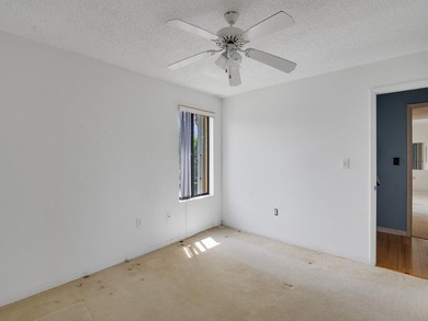 Discover this spacious 2-bedroom, 2-bathroom condo located on on Miles Grant Country Club in Florida - for sale on GolfHomes.com, golf home, golf lot