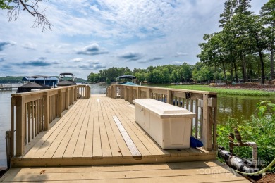 Welcome to your lakefront paradise! This beautiful lake home on Old North State Club at Uwharrie Point Golf community in North Carolina - for sale on GolfHomes.com, golf home, golf lot