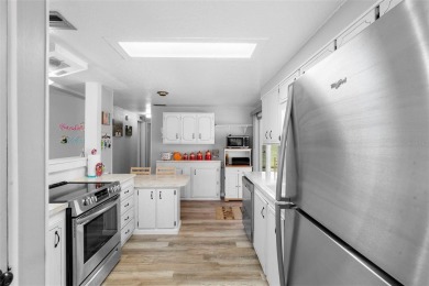 Welcome to this beautifully maintained 2-bedroom, 2-bathroom on Zellwood Station Country Club in Florida - for sale on GolfHomes.com, golf home, golf lot