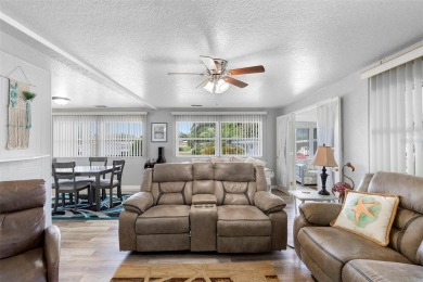 Welcome to this beautifully maintained 2-bedroom, 2-bathroom on Zellwood Station Country Club in Florida - for sale on GolfHomes.com, golf home, golf lot