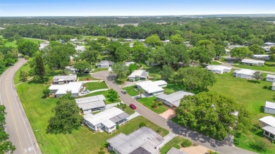 Welcome to this beautifully maintained 2-bedroom, 2-bathroom on Zellwood Station Country Club in Florida - for sale on GolfHomes.com, golf home, golf lot