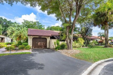 SPACIOUS WATERFRONT UNIT WITH NEW ROOF, GARAGE IN SOUGHT AFTER on Boca Lago Golf and Country Club in Florida - for sale on GolfHomes.com, golf home, golf lot