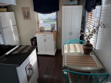 This cozy 2 bed, 1 bath furnished mobile home in the Waterway on Barefoot Resort and Golf Club  in South Carolina - for sale on GolfHomes.com, golf home, golf lot